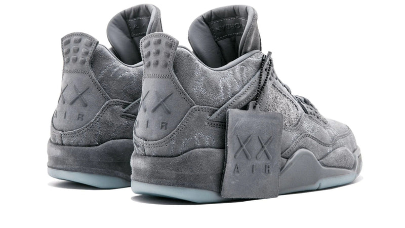 KAWS x Air Jordan 4 Retro – Rare Art Collab Sneaker with Glow-in-the-Dark Sole & Iconic XX Branding